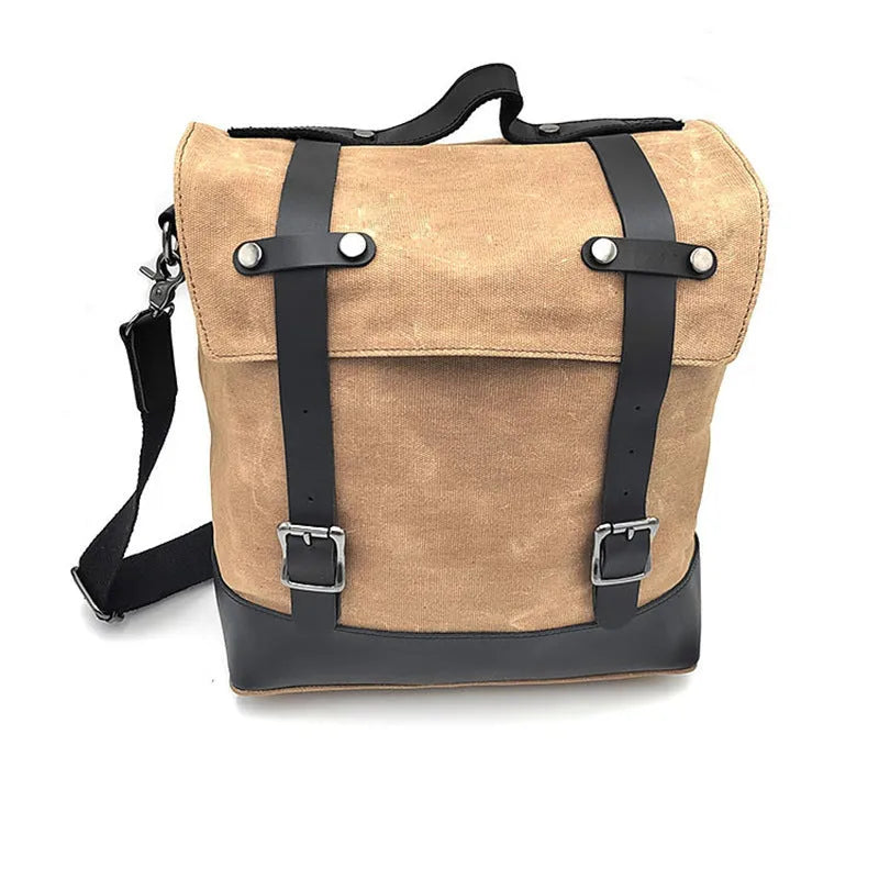 Motorcycle side bag with waterproof canvas construction showing mounting straps and main compartment