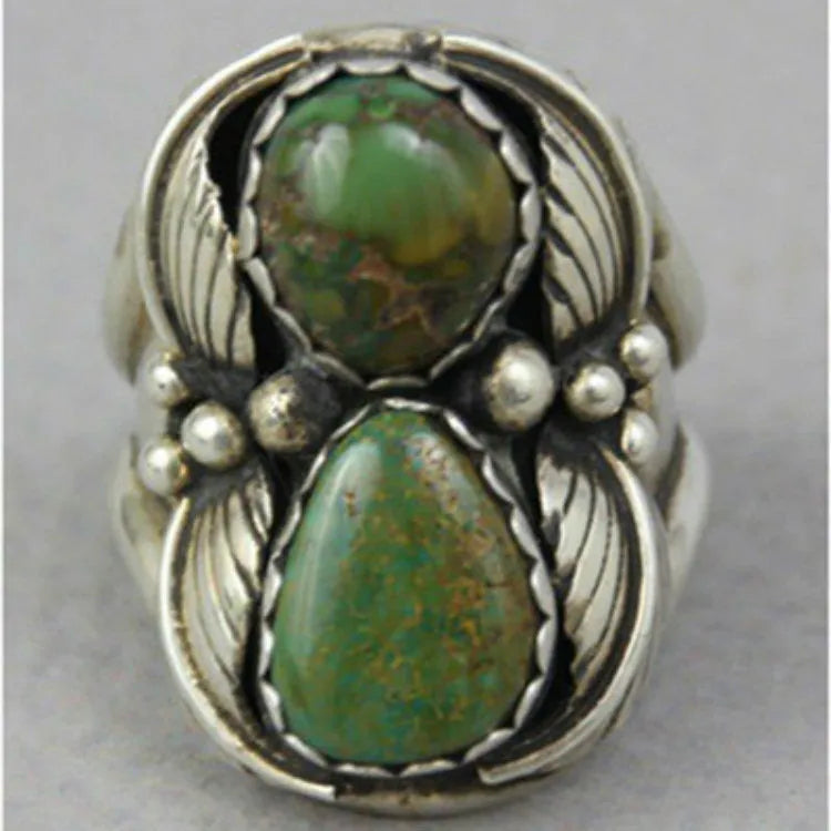 Women's geometric turquoise alloy ring with electroplated finish shown on finger