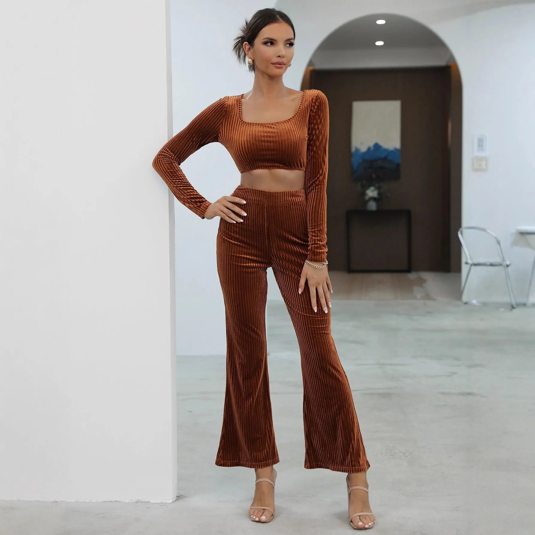 Caramel coloured long sleeve sweater and matching trousers casual set laid flat