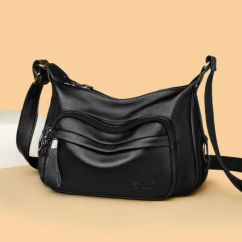 Large black or blue soft PU women's shoulder bag with crossbody strap and multiple internal pockets