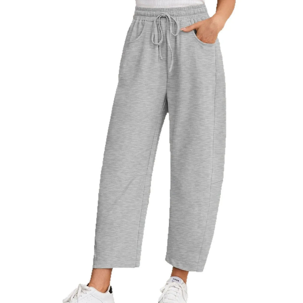 Women's loose cropped sweatpants with drawstring waist and side pockets in street fashion style