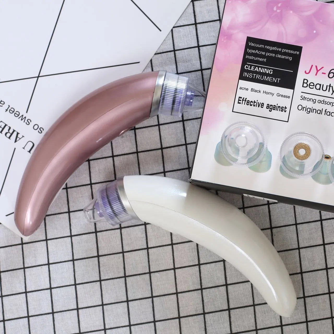 JY-666 electric blackhead suction instrument in rose gold or white for facial pore cleansing