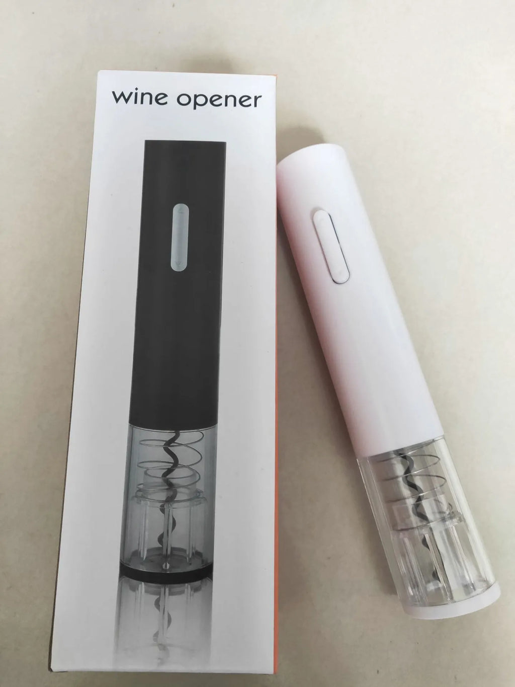 Black electric wine bottle opener with automatic corkscrew mechanism and integrated foil cutter