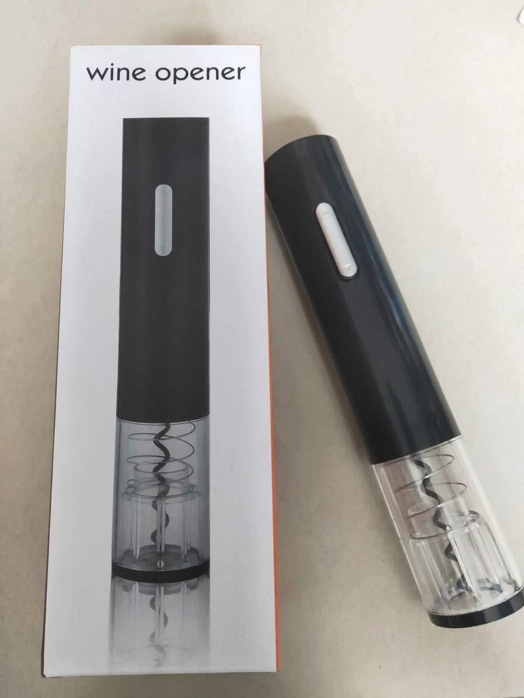 Black electric wine bottle opener with automatic corkscrew mechanism and integrated foil cutter