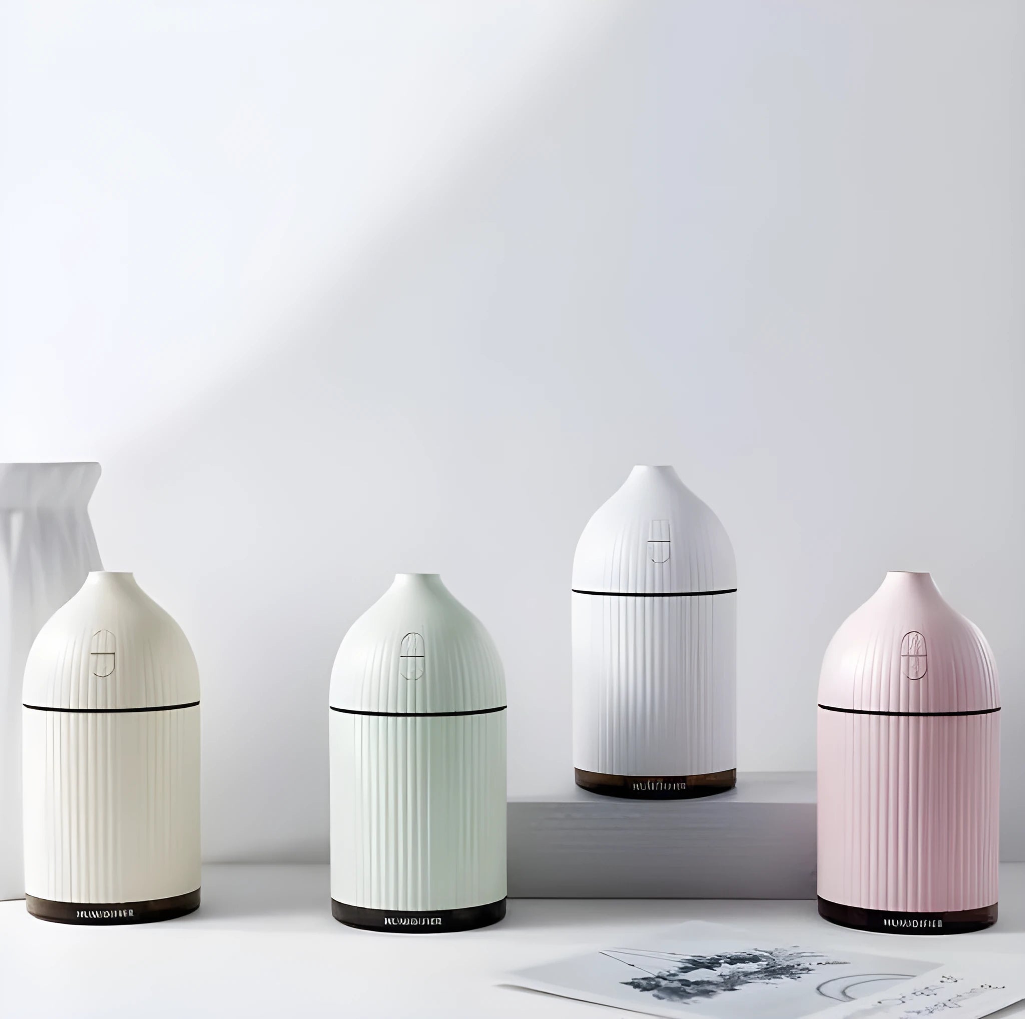 White ultrasonic aromatherapy diffuser with LED light and 300ml capacity for home use