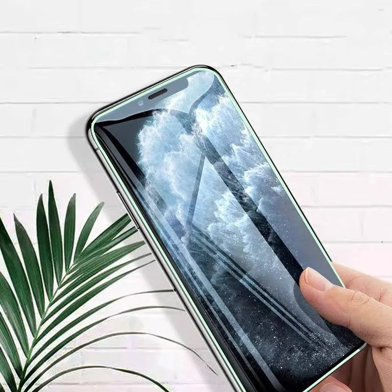 Luminous full cover tempered glass screen protector for iPhone showing glowing edge in dark.
