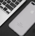 Silicone and TPU mobile phone case for Apple iPhone on a table in black, blue, red, and white colour options.