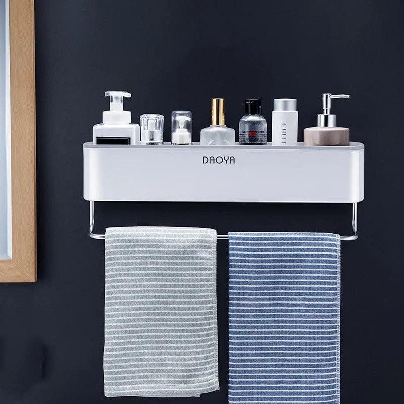 Black adhesive bathroom wall shelf holding shampoo and shower gel bottles.
