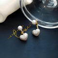 Heart-shaped stud earrings with artificial pearl gemstones in Korean style design
