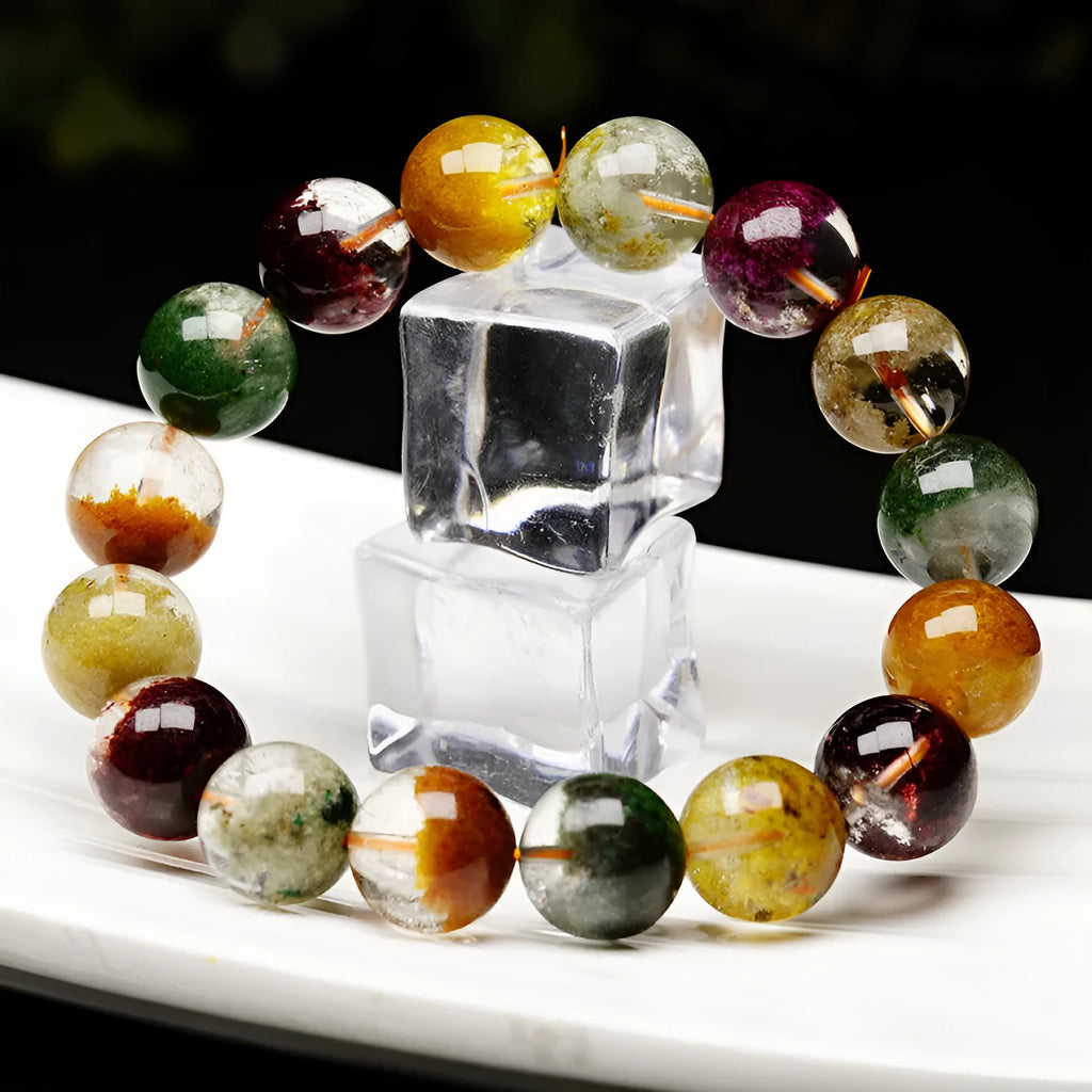 Natural crystal bracelet with 10mm beads showing ghost cornucopia ethnic design