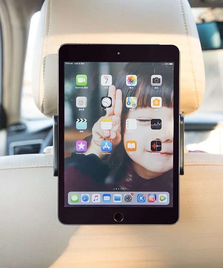 Black universal car phone holder mounted on a rear seat headrest, holding an iPad.