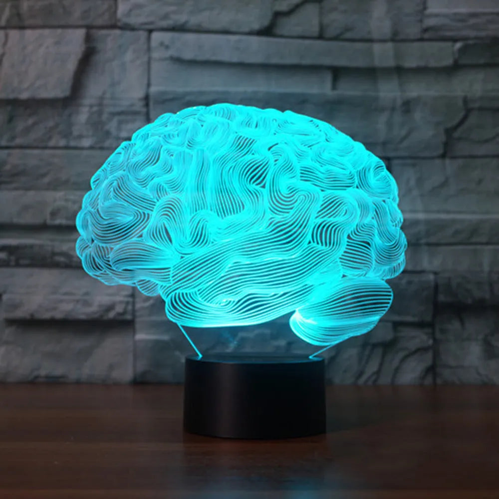 3D acrylic brain illusion LED desk lamp with colour changing remote control on wooden desk