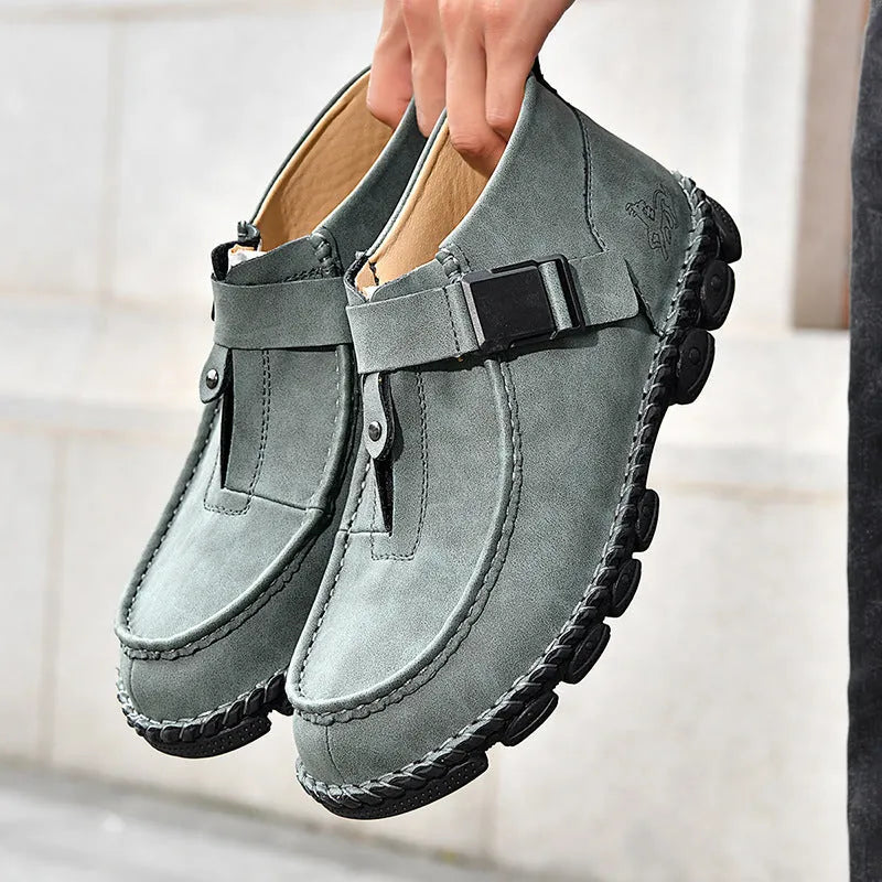 Men's black handmade stitched PU leather casual slip-on loafers with a flat sole.