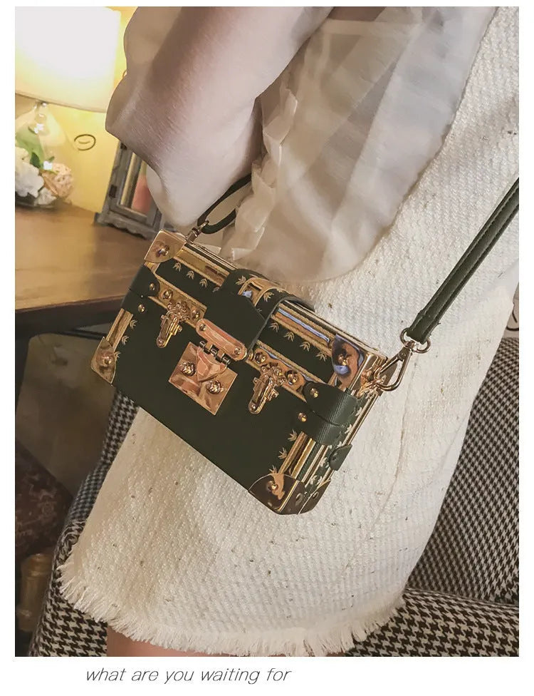 Women's hard PU shoulder bag with flap closure and single adjustable strap in black or green