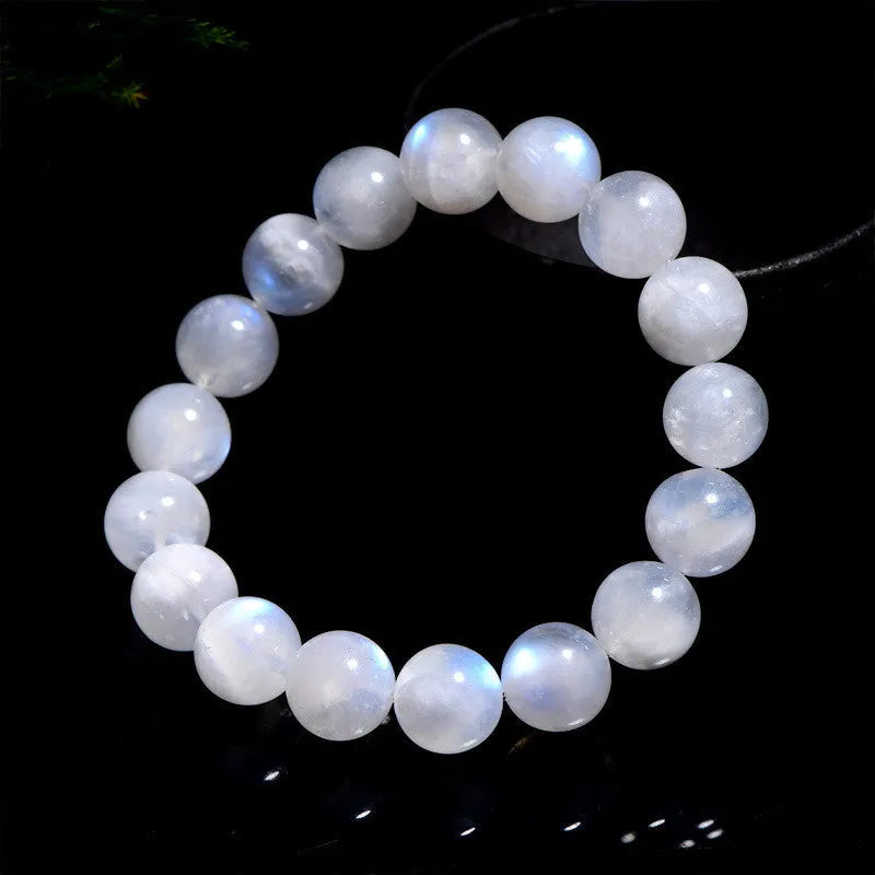 Natural blue moonlight moonstone round bead bracelet on wrist showing geometric arrangement