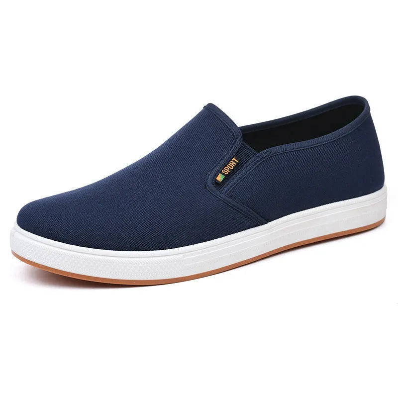 Men's black and blue canvas slip-on shoes with round toe and low-top design on composite sole