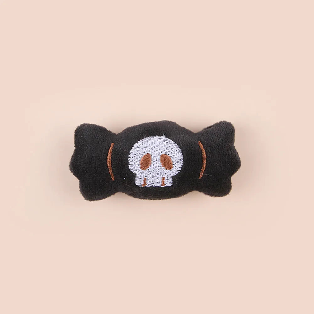 Plush cat teaser wand with colourful pom-pom attachment in candy pink design
