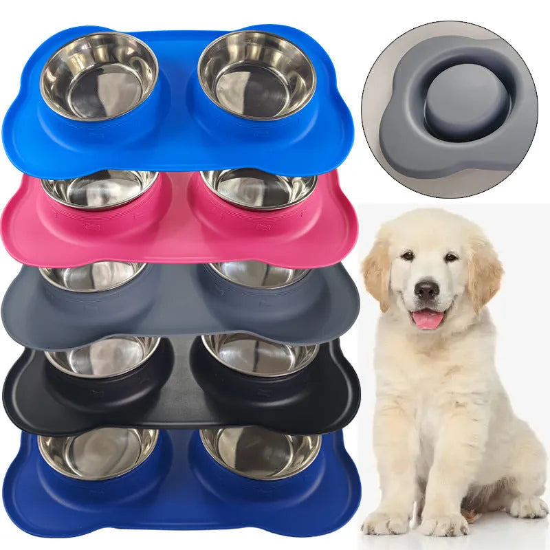 Large silicone dog bowl with a stainless steel inner insert, shown in blue on a floor.