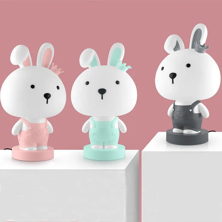 Cartoon animal table lamp in bear, cattle, rabbit, or tiger design with plastic shade and LED light.