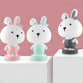 Cartoon animal table lamp in bear, cattle, rabbit, or tiger design with plastic shade and LED light.