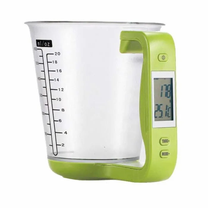 Green electronic kitchen scale measuring cup with LCD display built into handle showing weight measurement