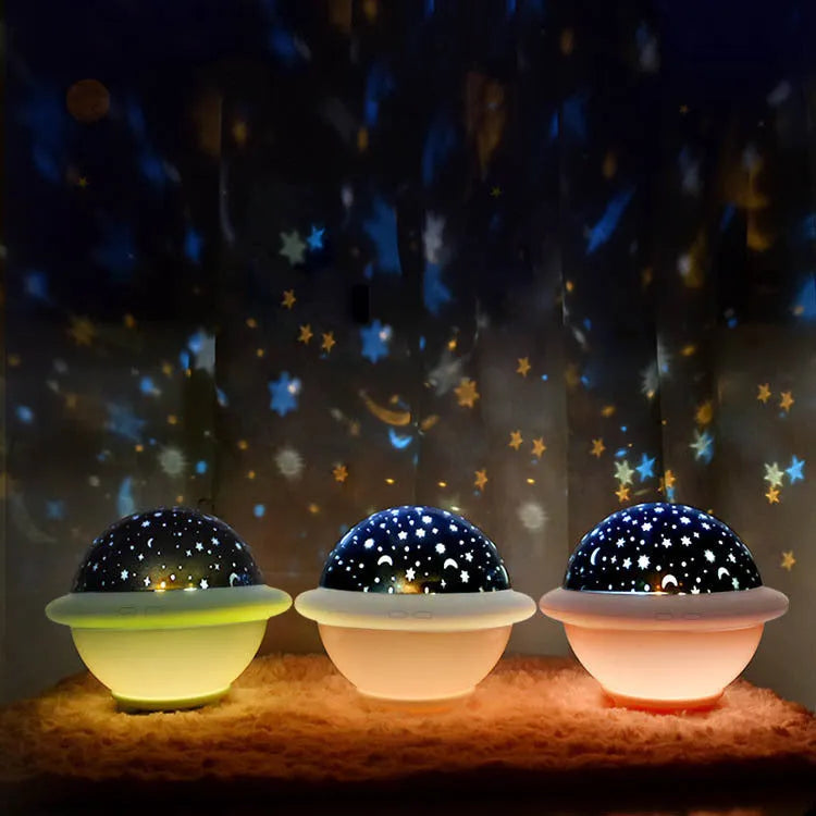 UFO-shaped starry sky projection night light in pink white or green plastic with constellation patterns