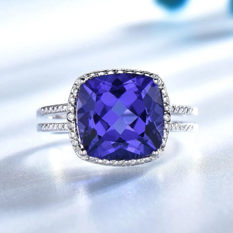 Women's sterling silver ring with blue Tanzanite gemstone, available in sizes 6 to 10