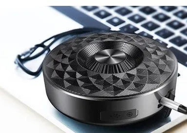 Wireless mini Bluetooth speaker showing three colour options: black, orange, and silvery white