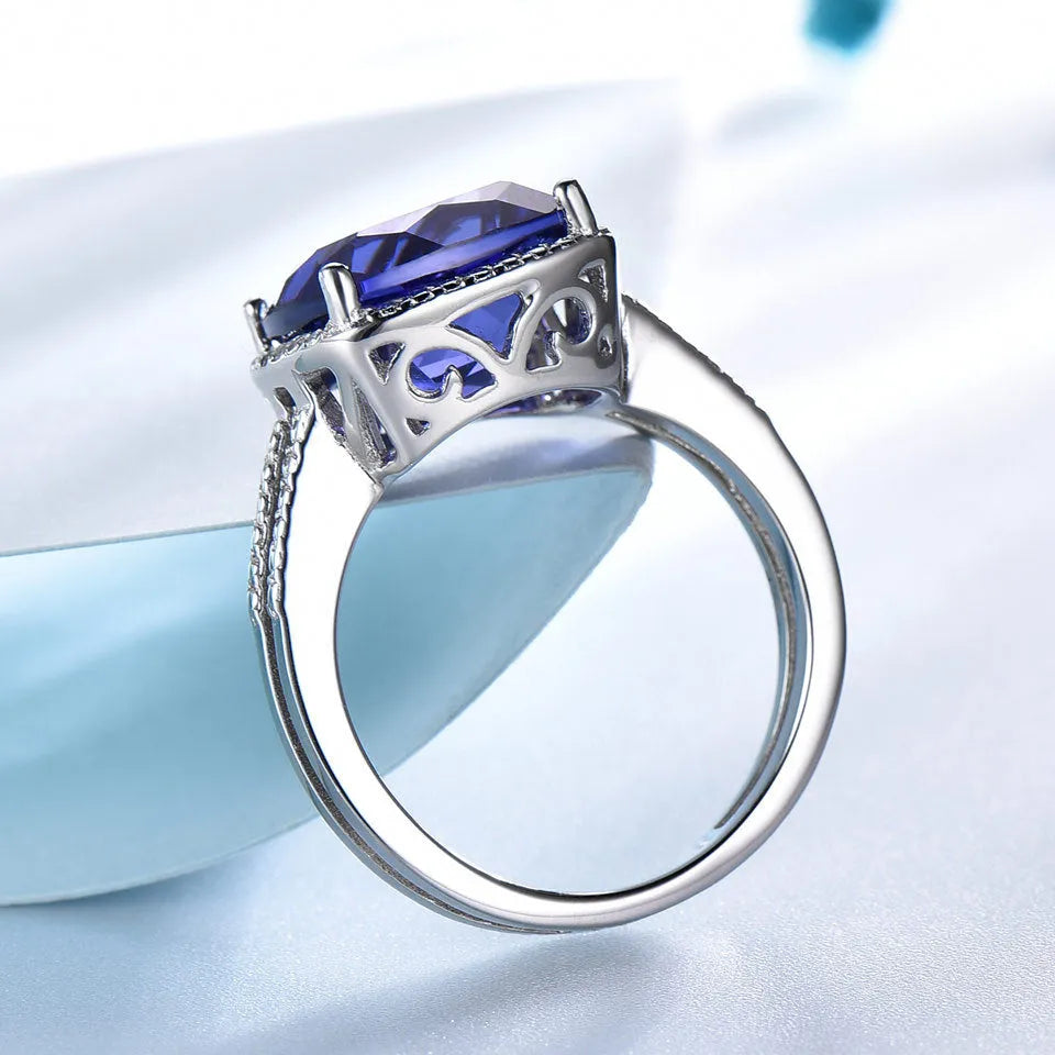 Women's sterling silver ring with blue Tanzanite gemstone, available in sizes 6 to 10