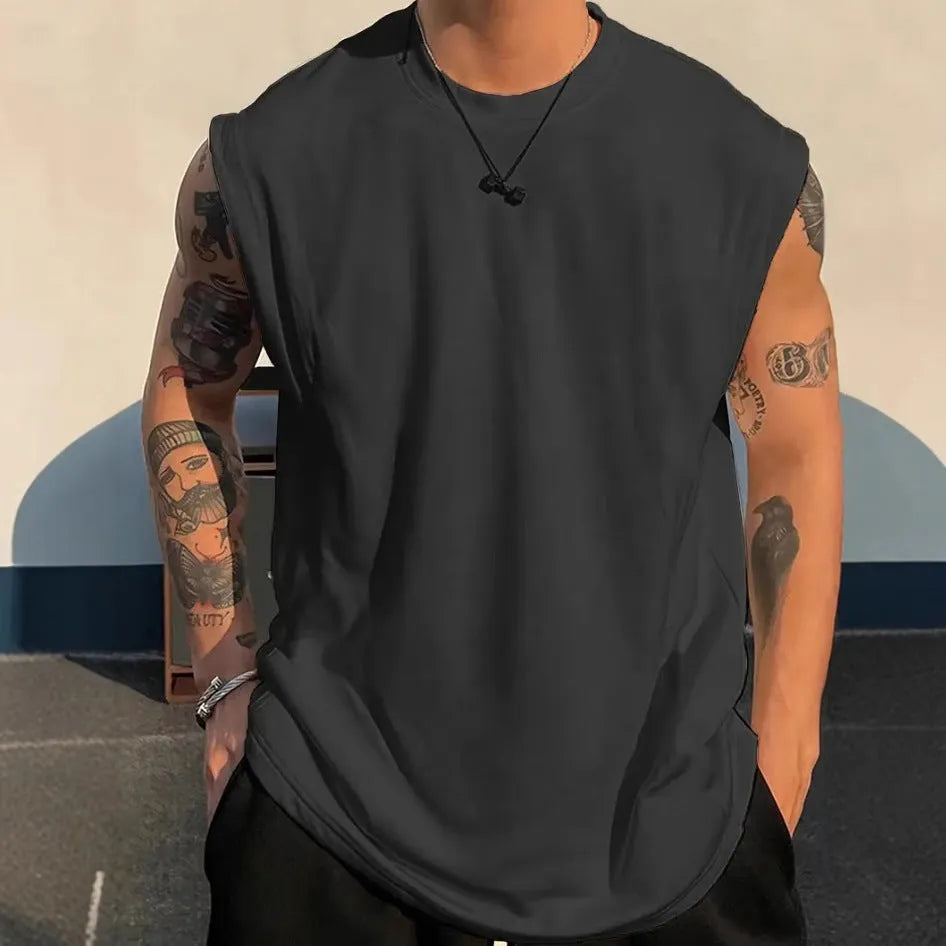 Men's loose fit solid colour cotton sleeveless t-shirt on a hanger, shown in apricot.