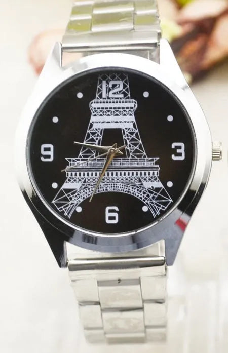 Silver and leather Eiffel Tower wrist watch showing analogue dial with Paris landmark graphic.