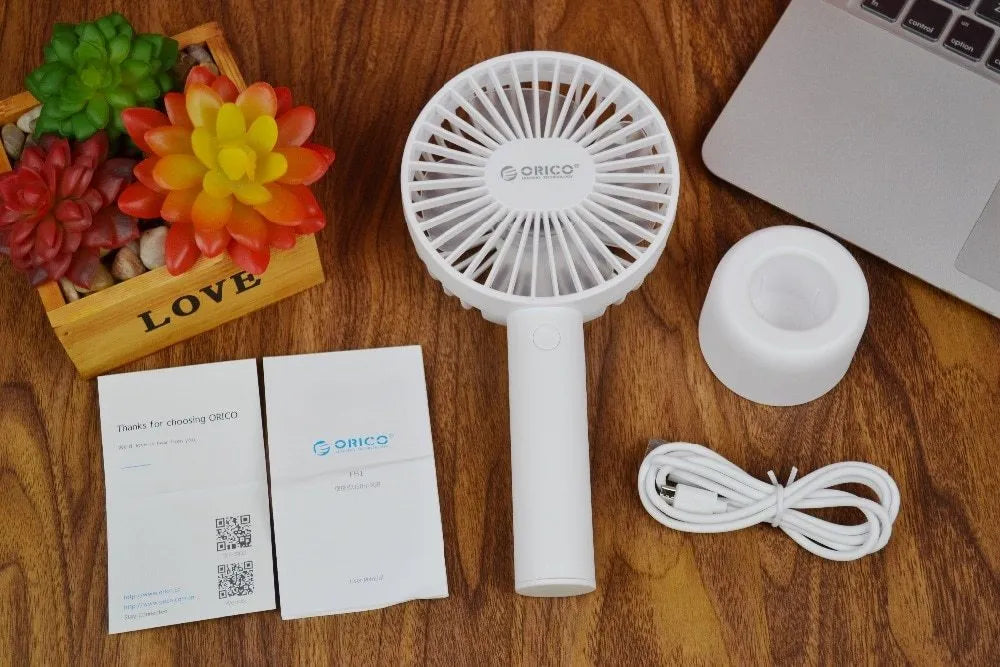 White ORICO FH1 USB rechargeable portable fan with fine line details on desktop
