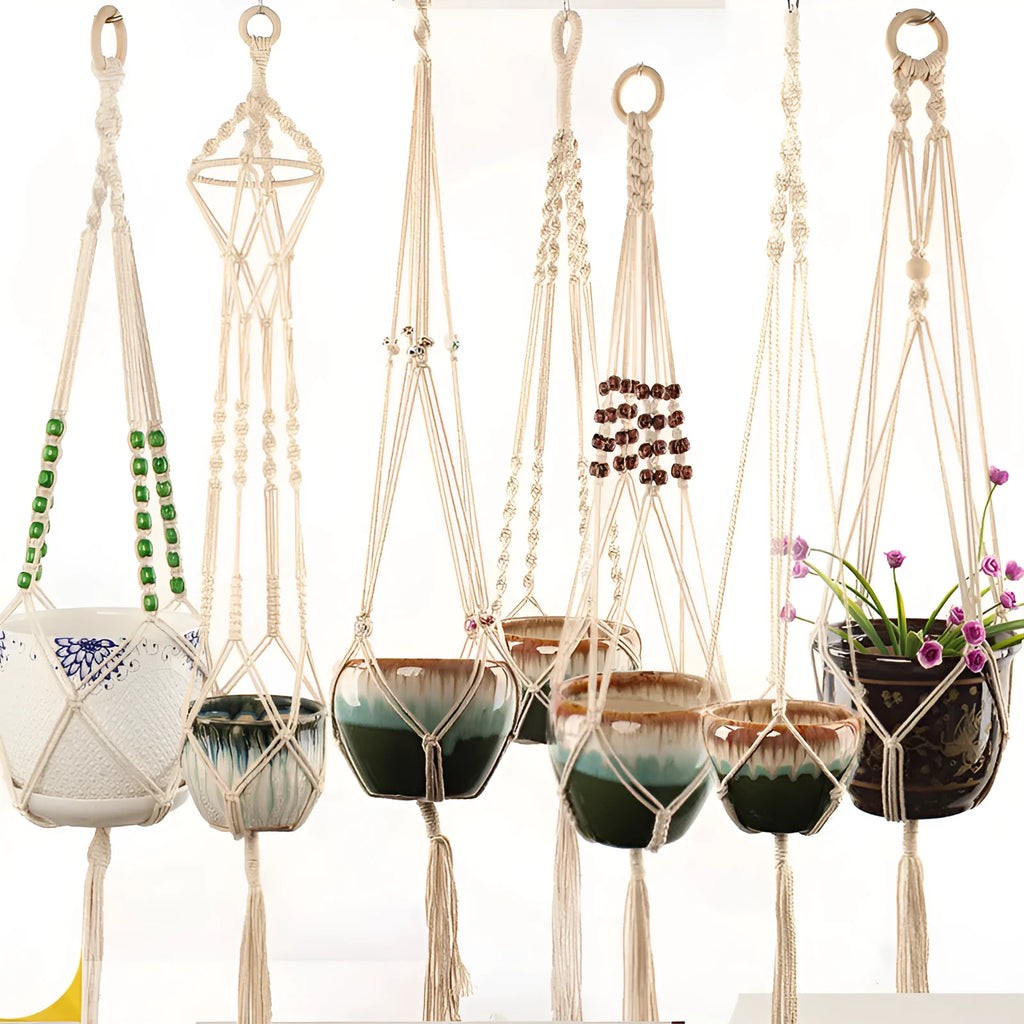 Woven wire cotton rope rustic hanging basket plant holder on a wall.