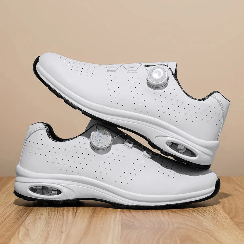 Low top tennis shoes in black with mesh upper, cross shoulder straps, and composite sole