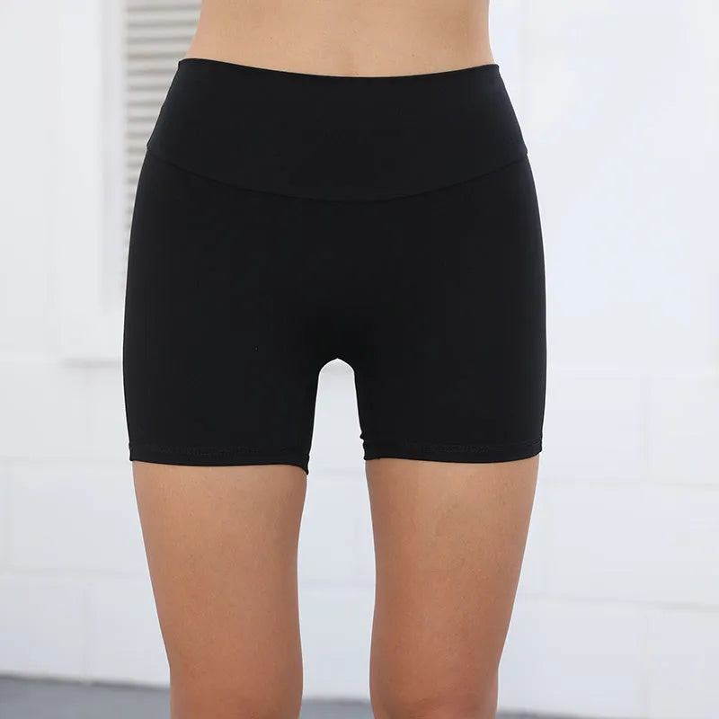 Women's high waist nylon fitness shorts with pockets in avocado green colour.