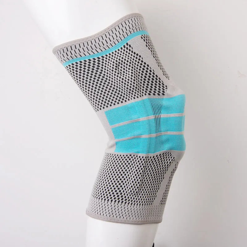 Sky blue silicone knee pad for basketball and sports on a knee.