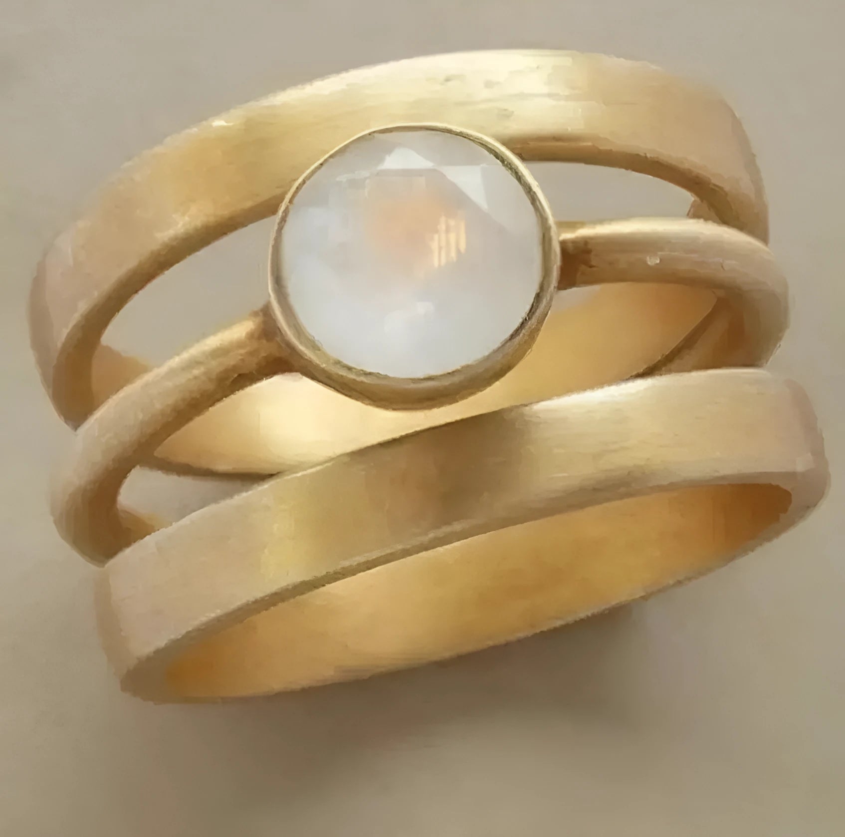 Geometric titanium steel ring with hollow micro-inlaid white chalcedony stones and gold electroplated finish