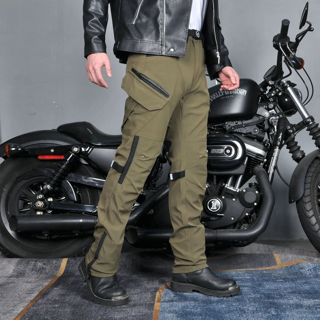 Men's black waterproof motorcycle cycling trousers with belt and protective gear on a hanger.