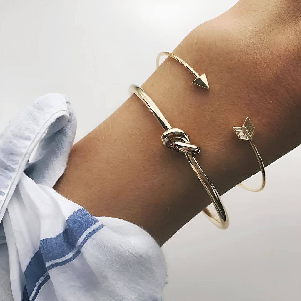 Gold electroplated women's vintage cuff bracelet with arrow knot detail