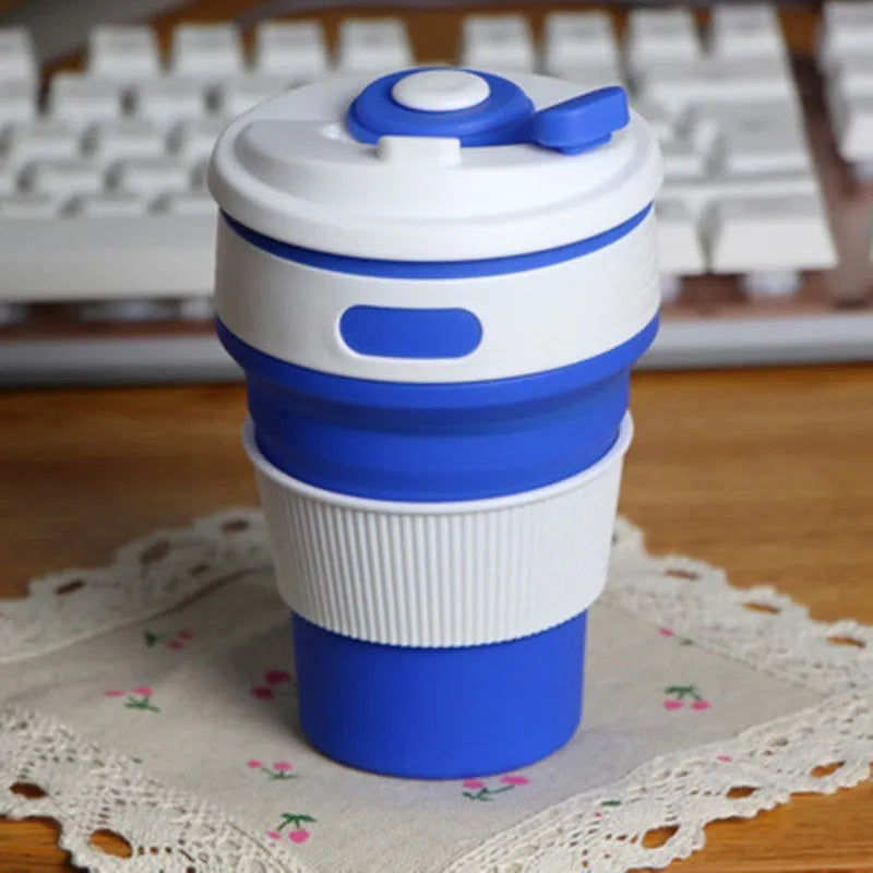 Green collapsible silicone travel cup shown folded and expanded with leak-proof cover