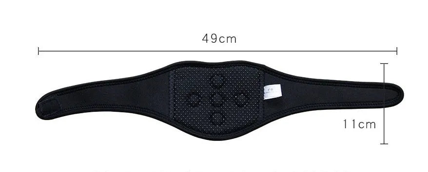 Black self-heating magnetic therapy neck guard with an adjustable shoulder strap laid flat.