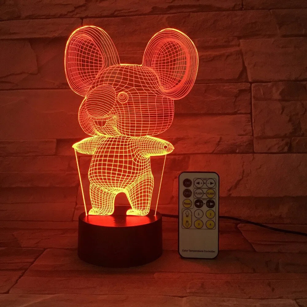 Black koala-shaped LED night light with remote control showing multiple colour illumination options