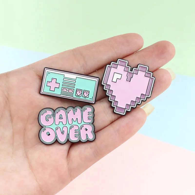Alloy game console badge with magnetic backing in CC1122, CC1123, and CC1124 colour options
