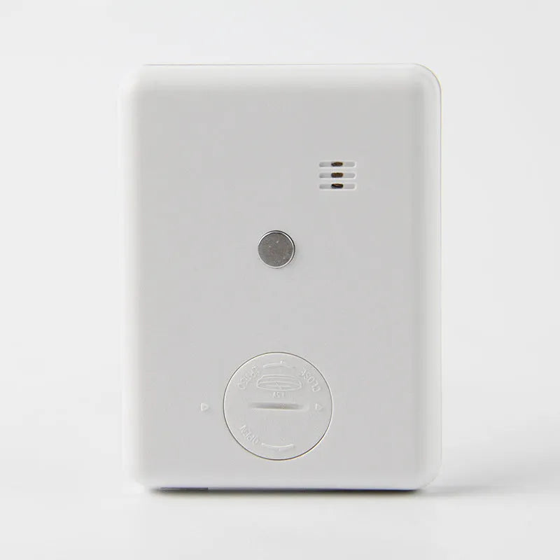 Black and white kitchen timer with magnetic back showing count-up and countdown functions