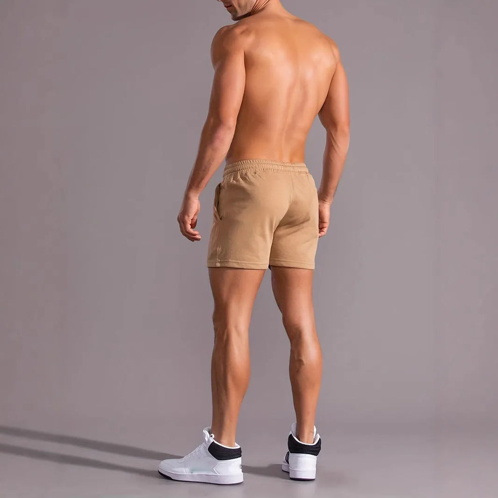 Man wearing khaki coconut print straight-leg sports shorts made of polyester