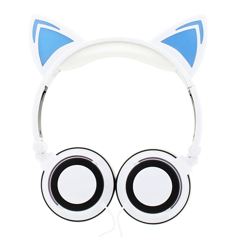 Colourful LED cat ear headphones with illuminated ears and cushions on a dark background.