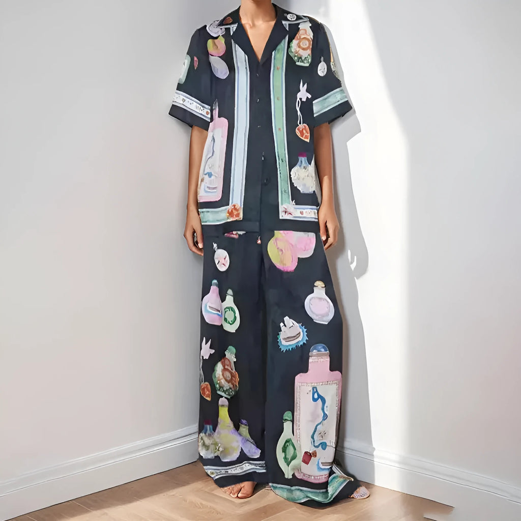 Black women's casual set with cartoon animation print showing cardigan top and matching trousers