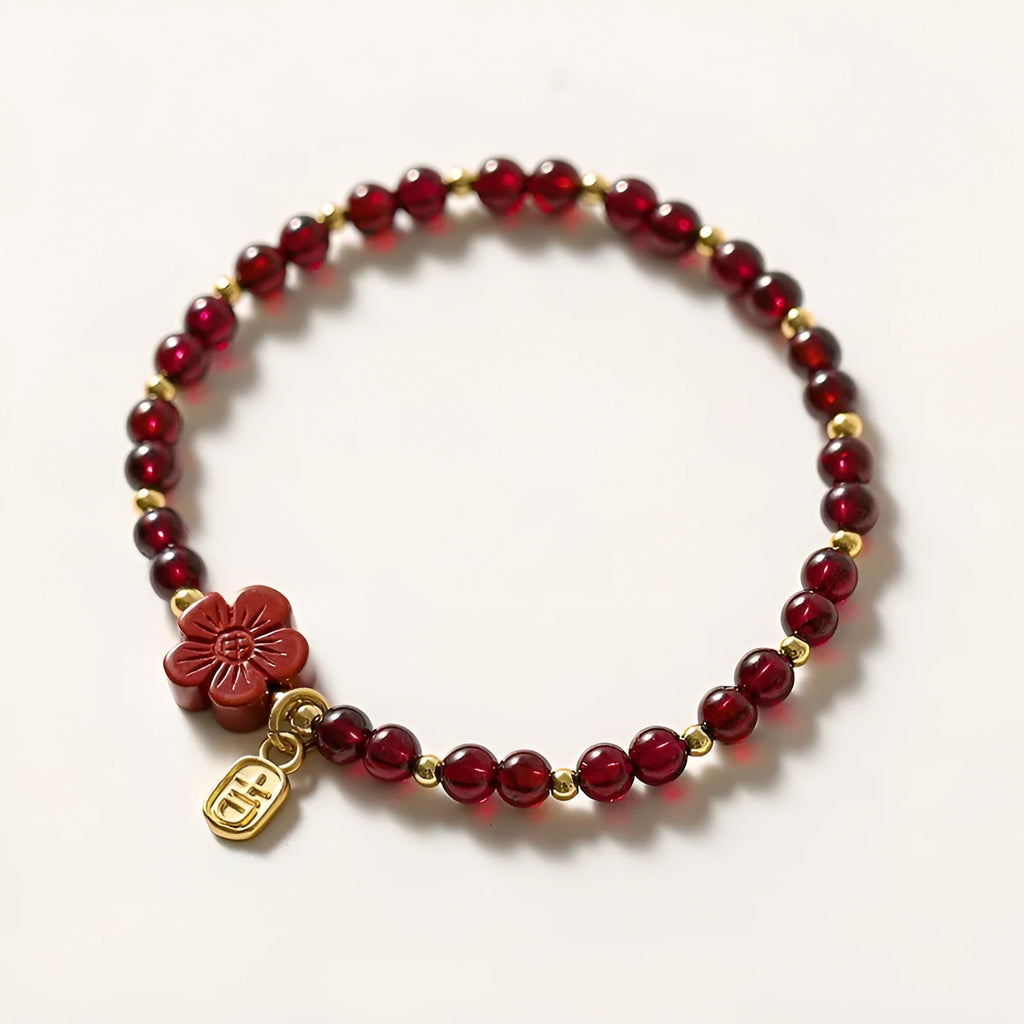 Women's freshwater pearl bracelet with crystal accents and geometric charms on elastic rope