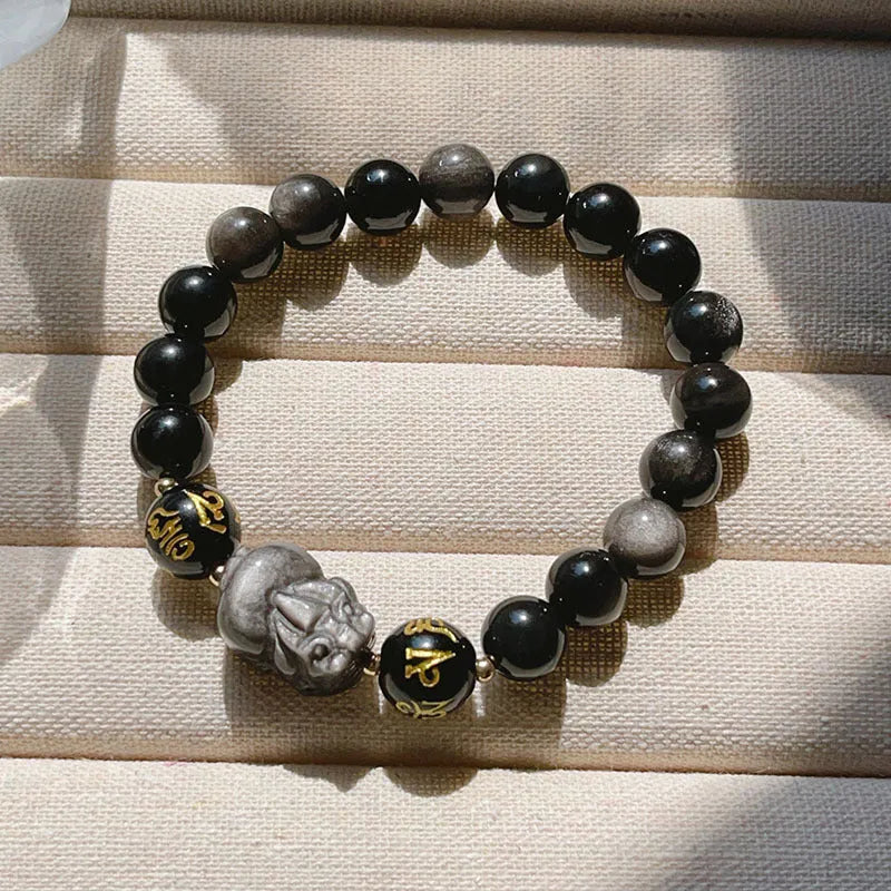Close-up of a men's adjustable Silverstone bracelet with Chinese zodiac beads and six-word proverbs.