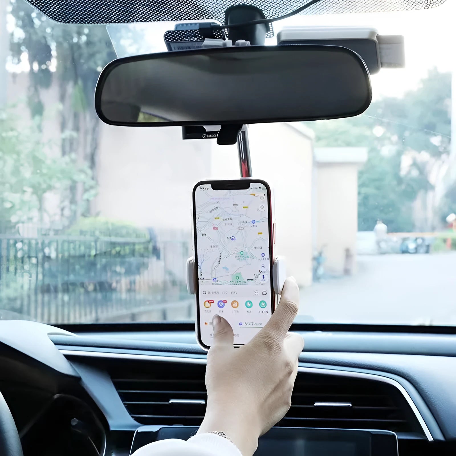 ABS plastic phone bracket mounted on vehicle rearview mirror holding smartphone